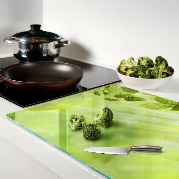 Schneidebrett Glas mit grünem Blattmotiv im Lichtdesign