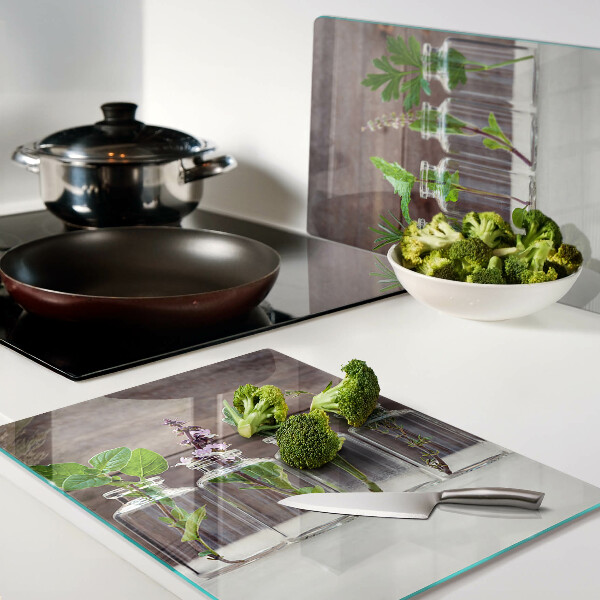 Glas-Schneidebrett mit dekorativem Motiv „Pflanzen in Flaschen”