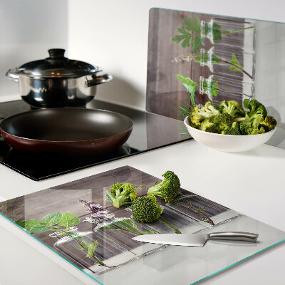 Glas-Schneidebrett mit dekorativem Motiv „Pflanzen in Flaschen”