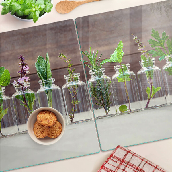 Glas-Schneidebrett mit dekorativem Motiv „Pflanzen in Flaschen”