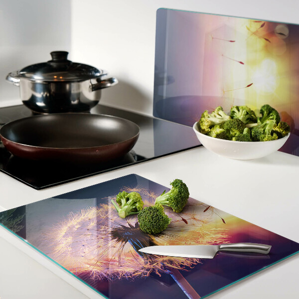 Schneidebrett Glas mit Motiv Löwenzahn vor einem Sonnenuntergang