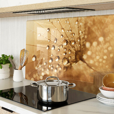 Glas schneidebrett mit Motiv von Wassertropfen auf einem Löwenzahn