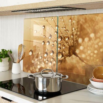 Glas schneidebrett mit Motiv von Wassertropfen auf einem Löwenzahn