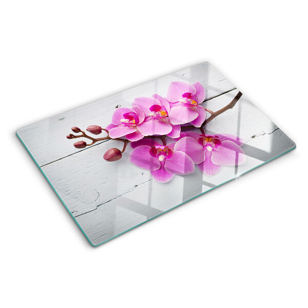 Schneidebrett glas Orchideen auf weißem Hintergrund