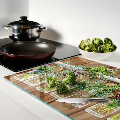 Schneidebrett Glas mit Motiv Kräuter in Gläsern auf Holzgrund