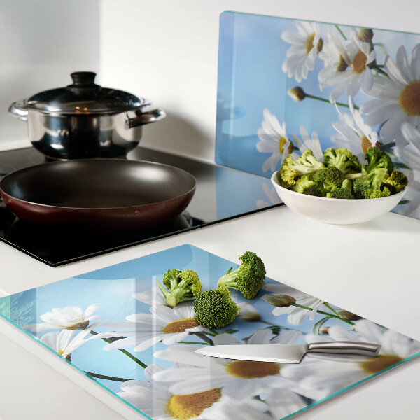 Schneidebrett Glas mit Gänseblümchen-Motiv auf blauem Hintergrund