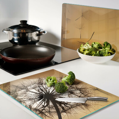 Schneidebrett glas Löwenzahn vor dem Hintergrund des Sonnenuntergangs