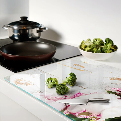 Glas-Schneidebrett mit Pfingstrosen auf Holzoptik