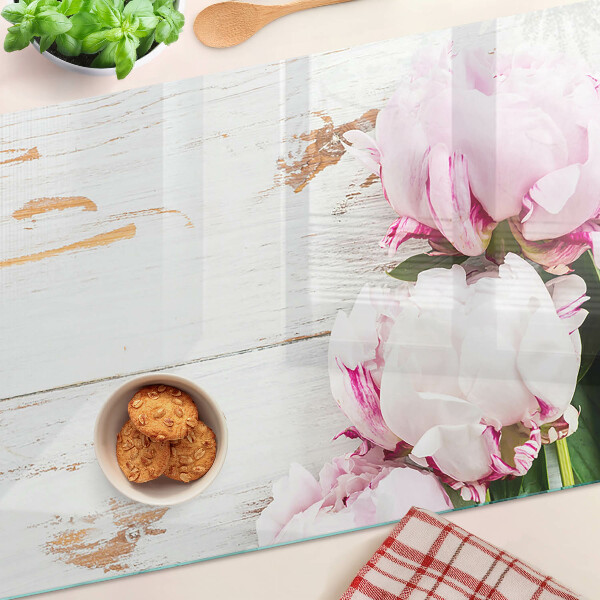 Glas-Schneidebrett mit Pfingstrosen auf Holzoptik