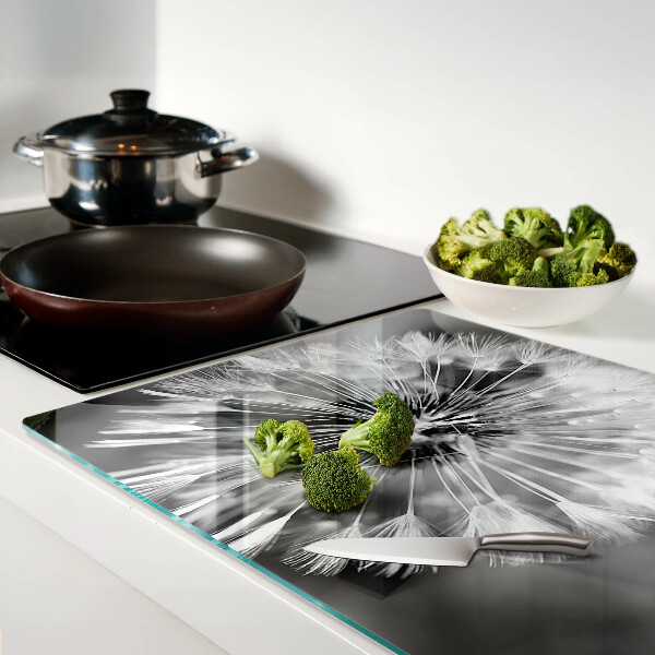 Glas-Schneidebrett mit schwarzweißem Löwenzahnmotiv