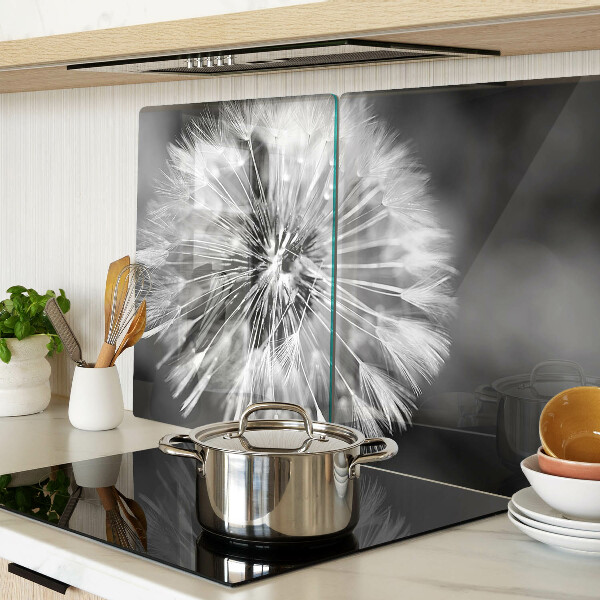 Glas-Schneidebrett mit schwarzweißem Löwenzahnmotiv