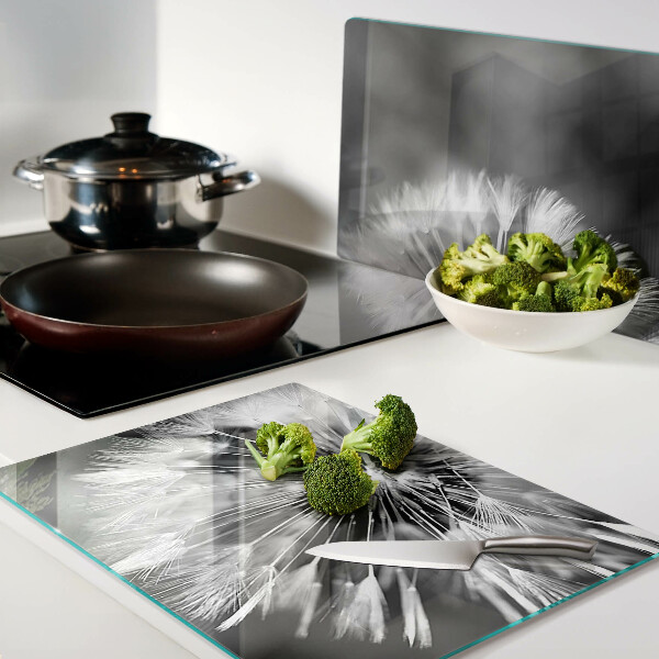 Glas-Schneidebrett mit schwarzweißem Löwenzahnmotiv