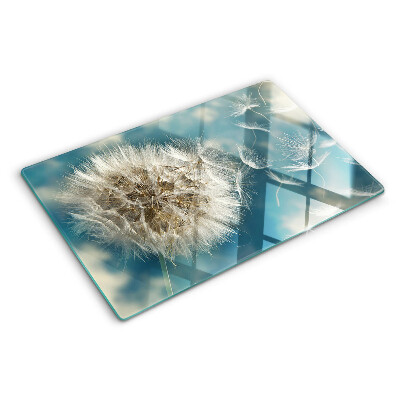 Glas-Schneidebrett mit Motiv eines Löwenzahns vor dem Himmel