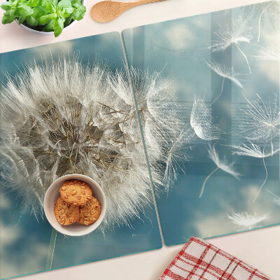 Glas-Schneidebrett mit Motiv eines Löwenzahns vor dem Himmel