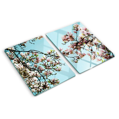 Glas schneidebrett Magnolienblüten auf blauem Hintergrund