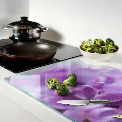 Schneidebrett Glas mit Blumen in Lilatönen