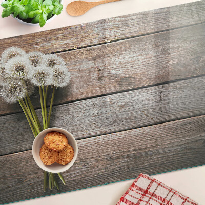 Schneidebrett Glas mit Motiv aus Löwenzahnblüten auf Holzoptik