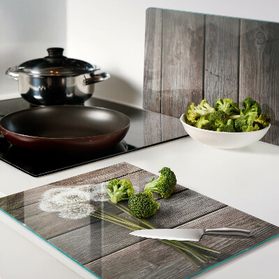 Schneidebrett Glas mit Motiv aus Löwenzahnblüten auf Holzoptik