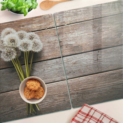 Schneidebrett Glas mit Motiv aus Löwenzahnblüten auf Holzoptik