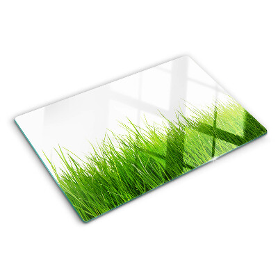 Glas schneidebrett Gras in der Sonne