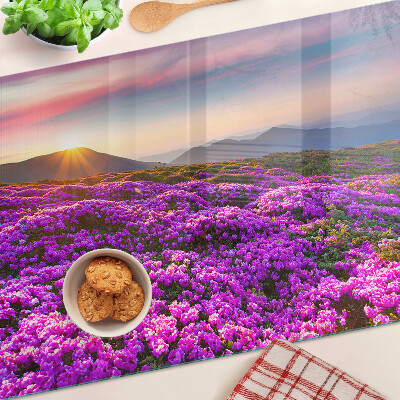 Schneidebrett Glas mit Motiv einer Blumenlandschaft bei Sonnenuntergang