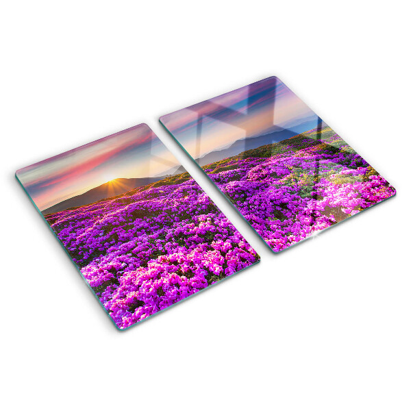 Schneidebrett Glas mit Motiv einer Blumenlandschaft bei Sonnenuntergang