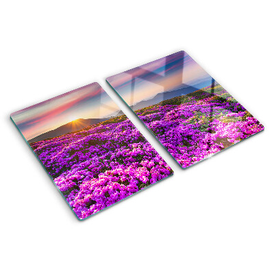 Schneidebrett Glas mit Motiv einer Blumenlandschaft bei Sonnenuntergang