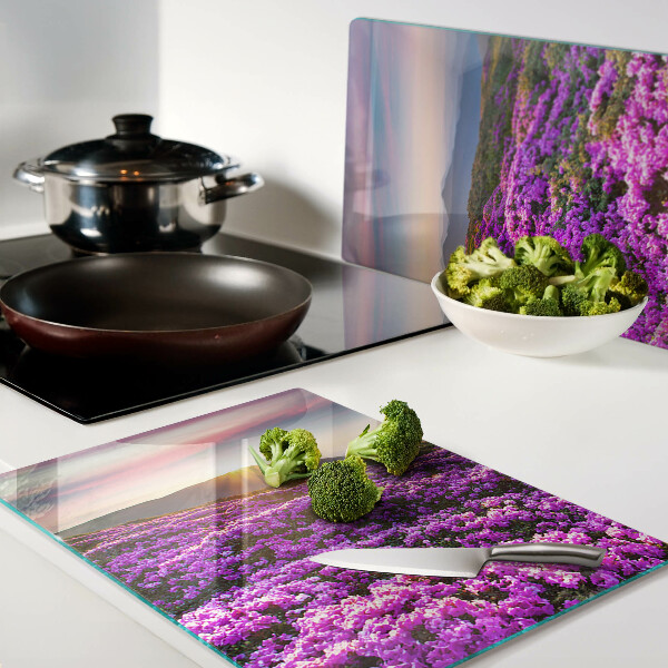 Schneidebrett Glas mit Motiv einer Blumenlandschaft bei Sonnenuntergang
