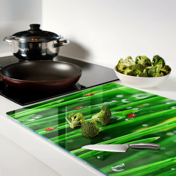 Schneidebrett Glas mit Motiv Wassertropfen auf Gras und Marienkäfern