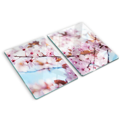 Schneidebrett Glas mit Kirschblüten auf blauem Hintergrund