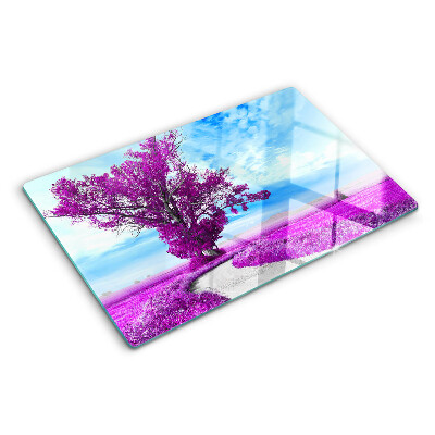 Schneidebrett mit Motiv eines violetten Baumes vor dem Himmel