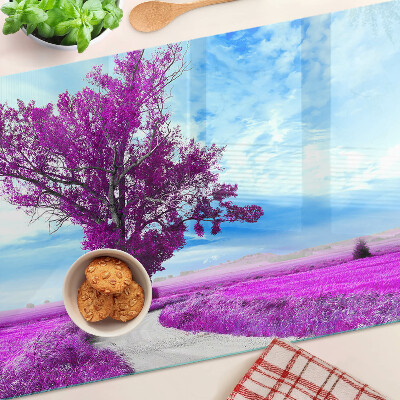 Schneidebrett Ein violetter Baum vor dem Himmel