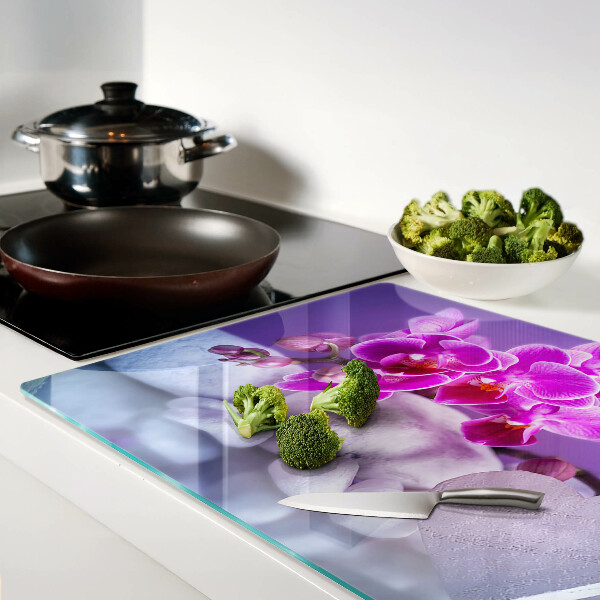 Schneidebrett Glas mit Orchideenmotiv auf Steinen