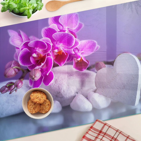 Schneidebrett Glas mit Orchideenmotiv auf Steinen