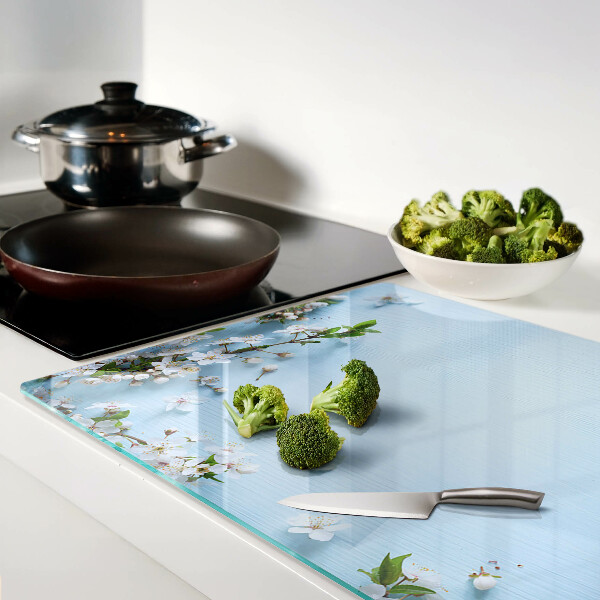 Glas schneidebrett Blumenmuster auf blauem Hintergrund