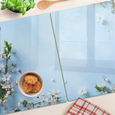 Glas schneidebrett Blumenmuster auf blauem Hintergrund