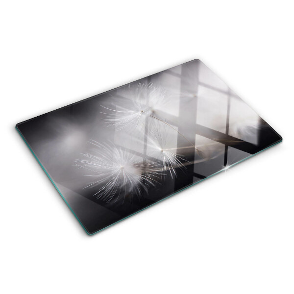 Schneidebrett glas Flauschige Löwenzahnblüten vor dem Fensterhintergrund