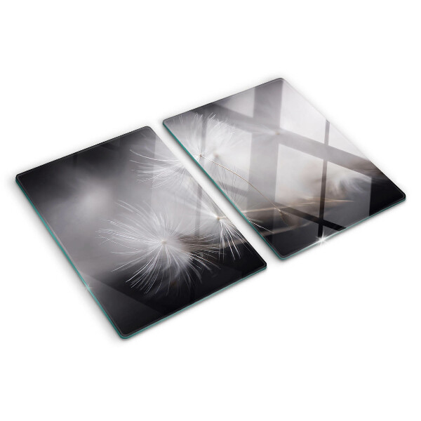 Schneidebrett glas Flauschige Löwenzahnblüten vor dem Fensterhintergrund