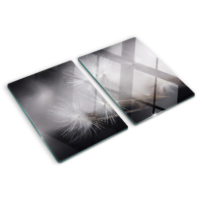 Schneidebrett glas Flauschige Löwenzahnblüten vor dem Fensterhintergrund