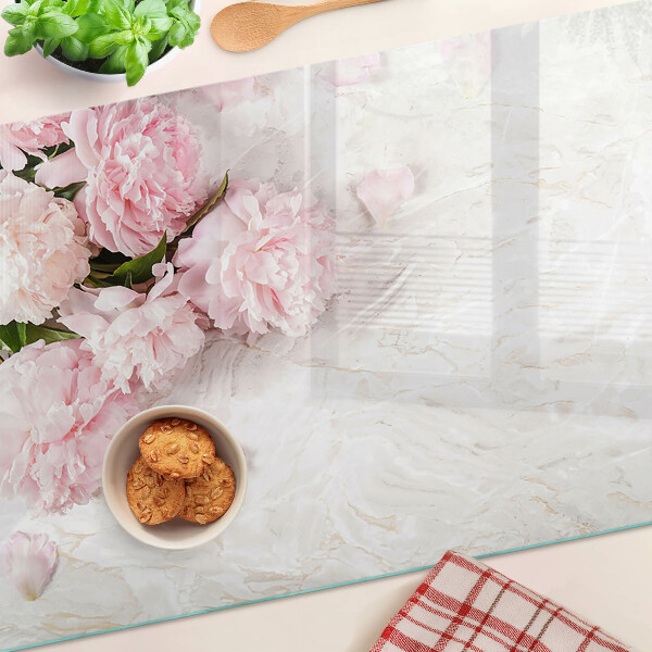 Glas schneidebrett Pfingstrosen auf Marmorgrund