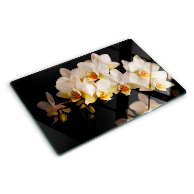 Glas Schneidebrett mit Orchideen-Motiv auf schwarzem Hintergrund