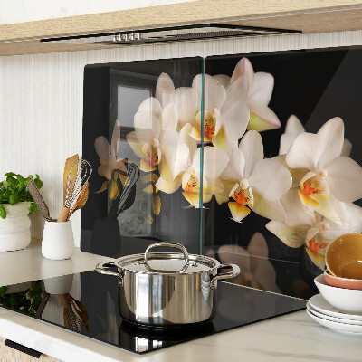 Glas Schneidebrett mit Orchideen-Motiv auf schwarzem Hintergrund
