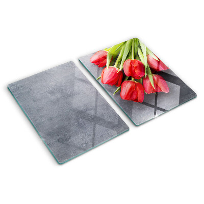 Glas-Schneidebrett mit Tulpenmotiv auf grauem Hintergrund