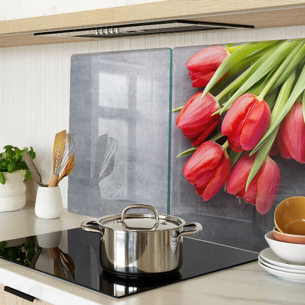 Glas-Schneidebrett mit Tulpenmotiv auf grauem Hintergrund