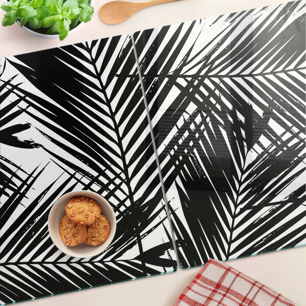 Schneidebrett Glas mit schwarzem und weißem Palmenblattmotiv