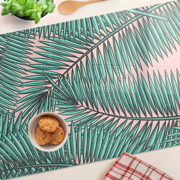 Glas schneidebrett Palmenblätter auf rosa Hintergrund