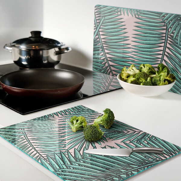 Glas schneidebrett Palmenblätter auf rosa Hintergrund