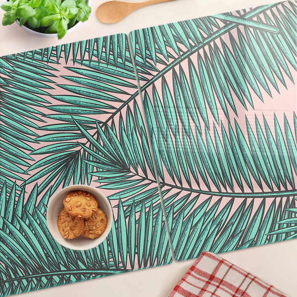 Glas schneidebrett Palmenblätter auf rosa Hintergrund
