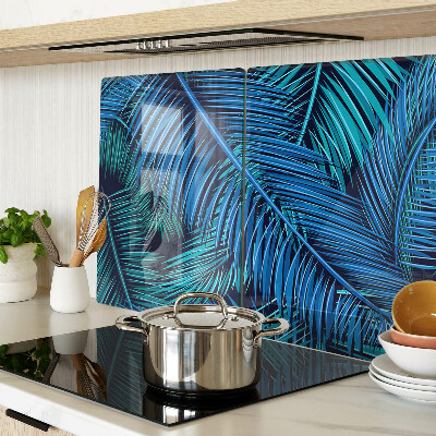 Glas-Schneidebrett mit Palmenblättern in Blautönen