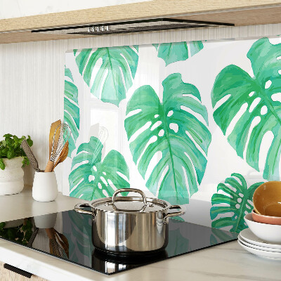 Glas schneidebrett Monstera-Blätter auf weißem Hintergrund